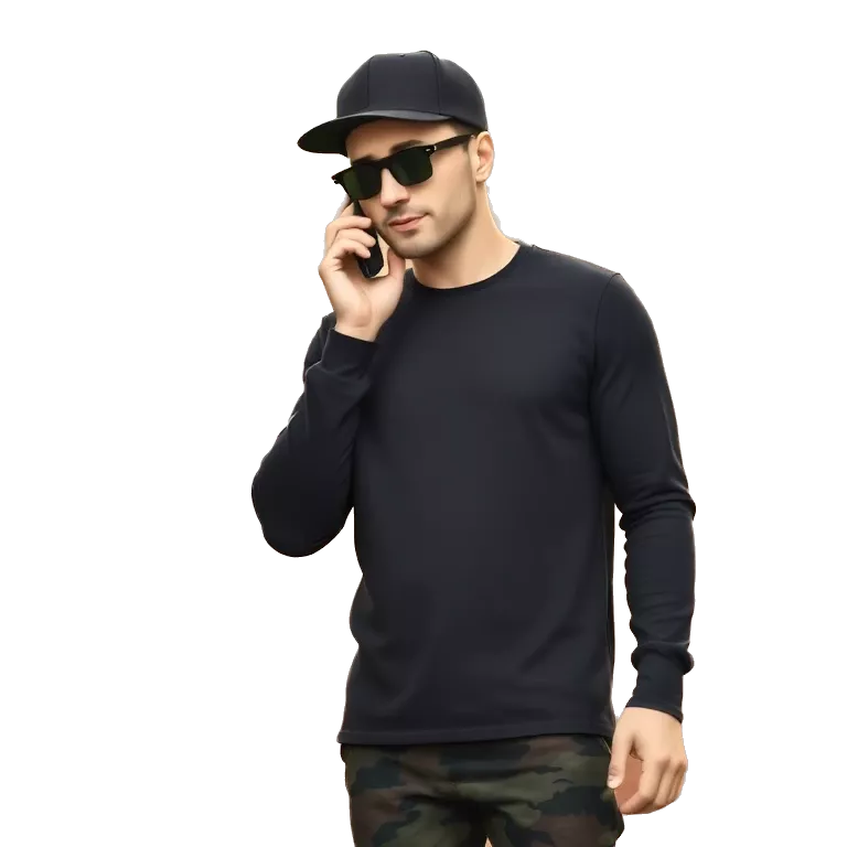 A cool character standing with confidence, wearing a black long-sleeve shirt, a dark cap, and colorful camo pants. He holds a phone to his ear like a boss, slightly tilted pose, with urban streetwear attitude. Background is a sunlit brick wall. Add sunglasses,